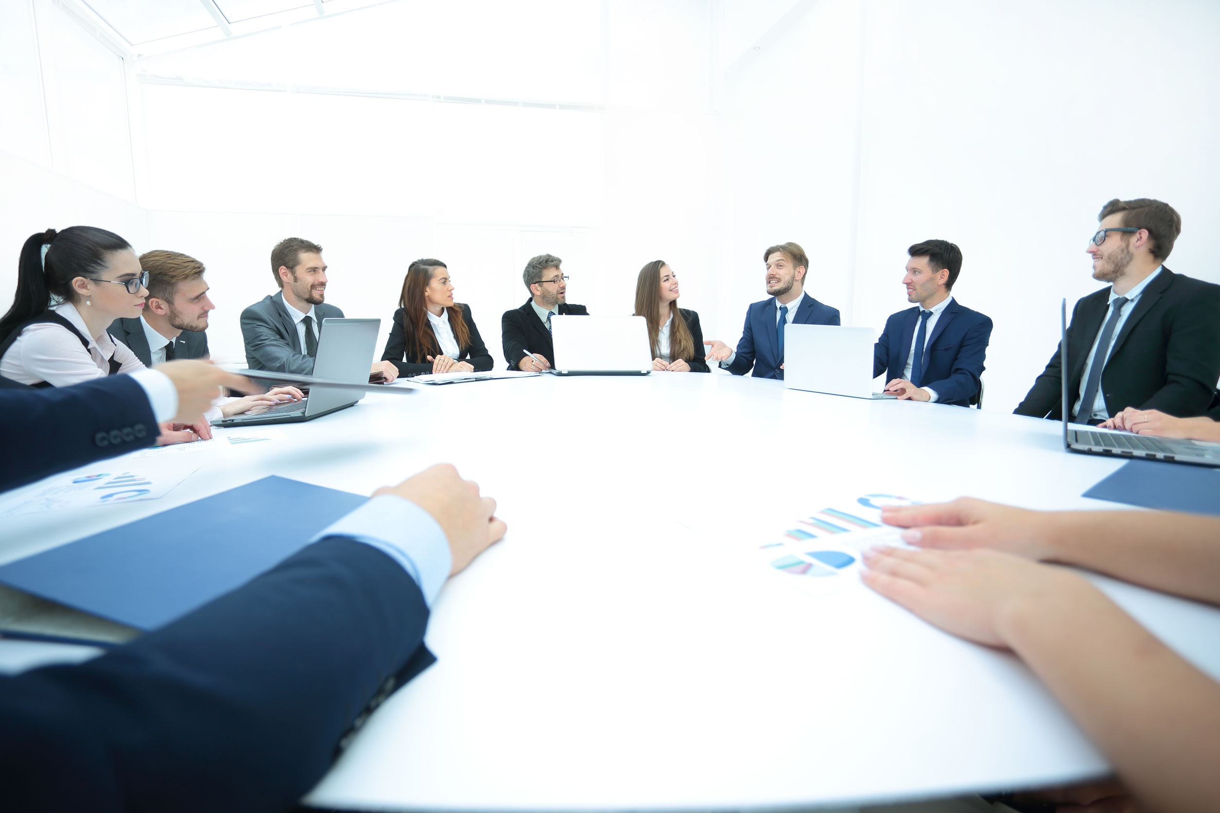 business people listening to presentation about gm jobs