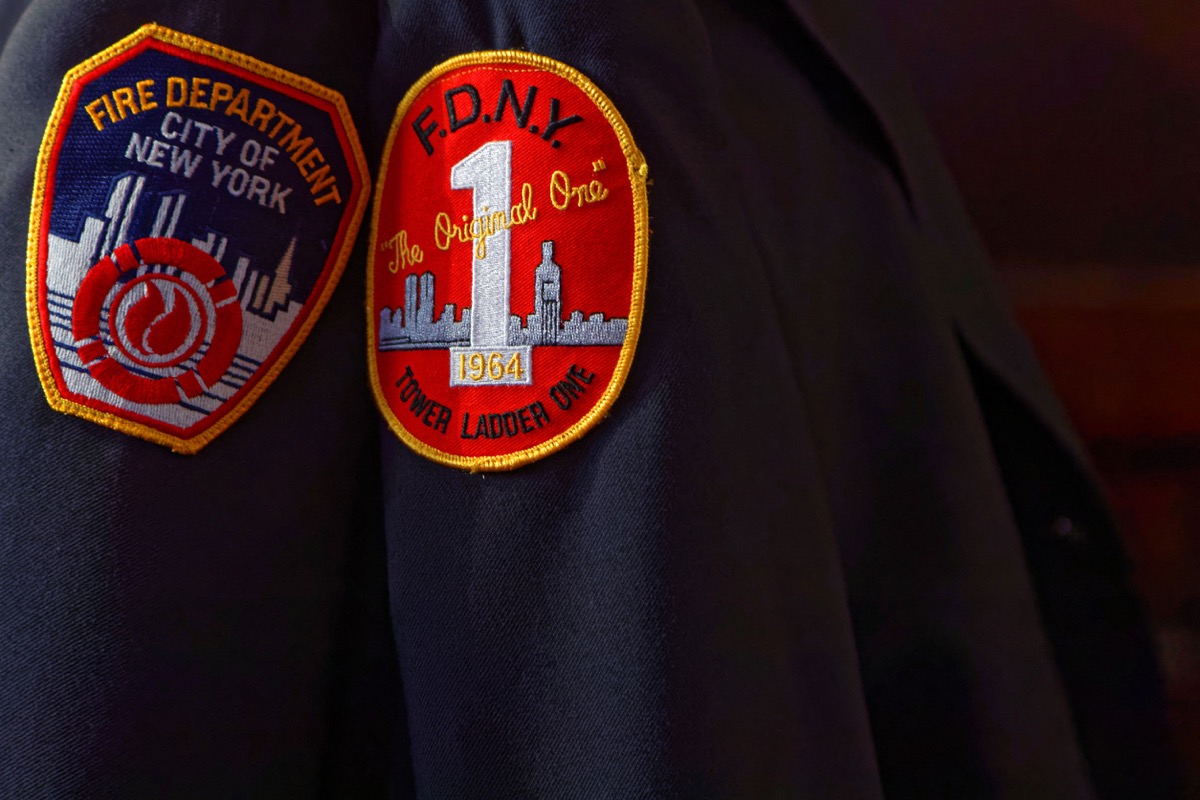 Fire Department of New-York badges on a fireman uniform; International Association of Firefighters