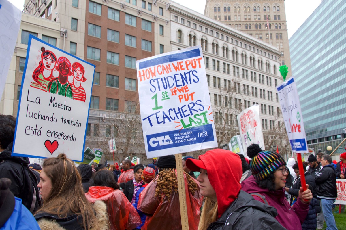 Oakland, CA - February 25, 2019: Unidentified participants at Oakland teachers strike day 3 rallying at Frank Ogawa Plaza. Fighting for smaller class sizes and bigger paychecks; community engagement concept