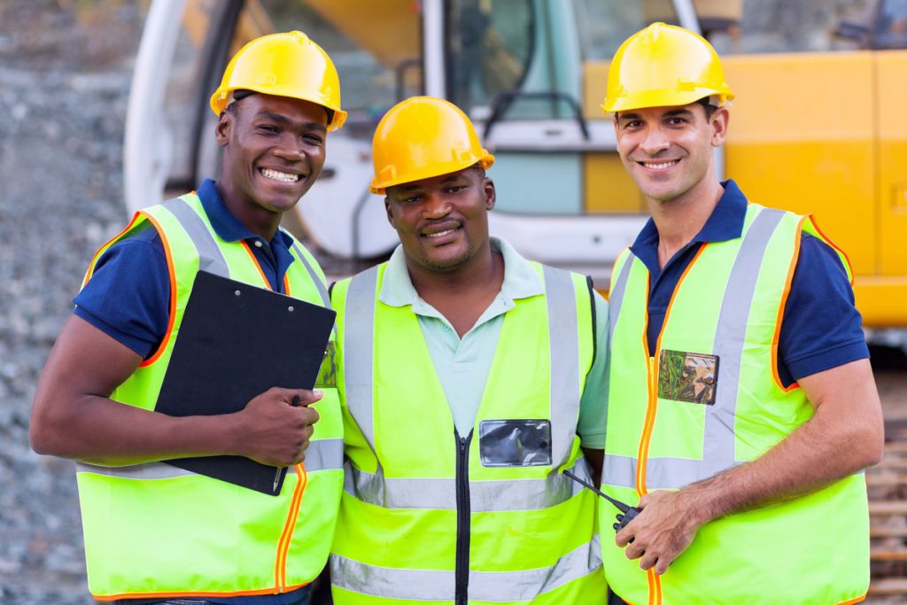 portrait of smiling construction workers