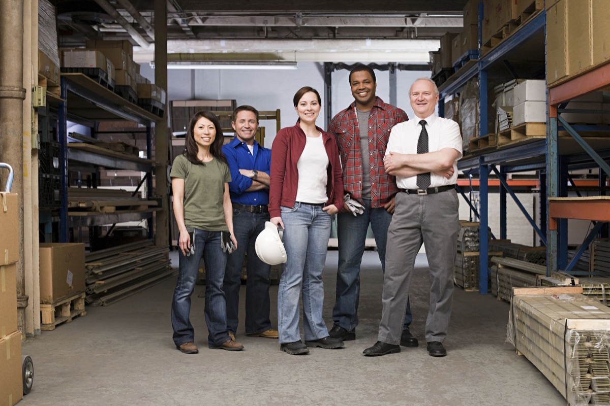 Workers in warehouse; unions and mass unemployment concept