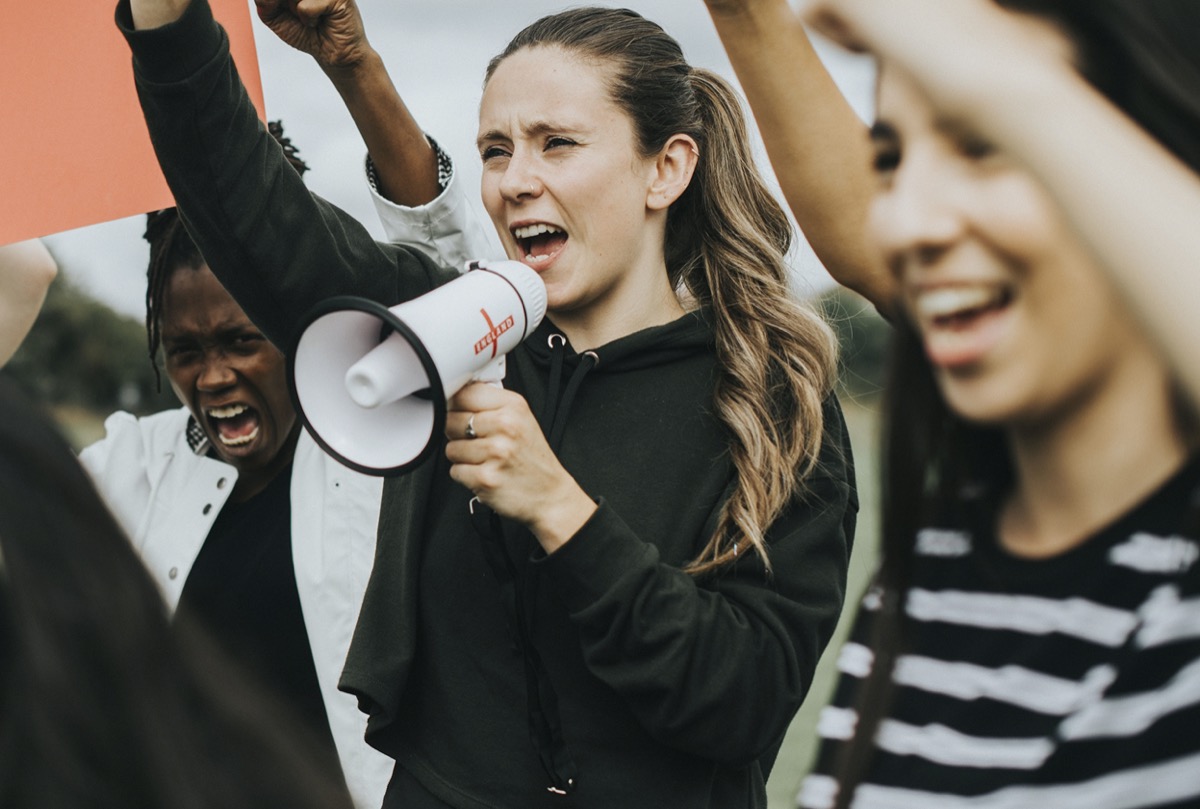Group of female activists is protesting; support front-line workers concept