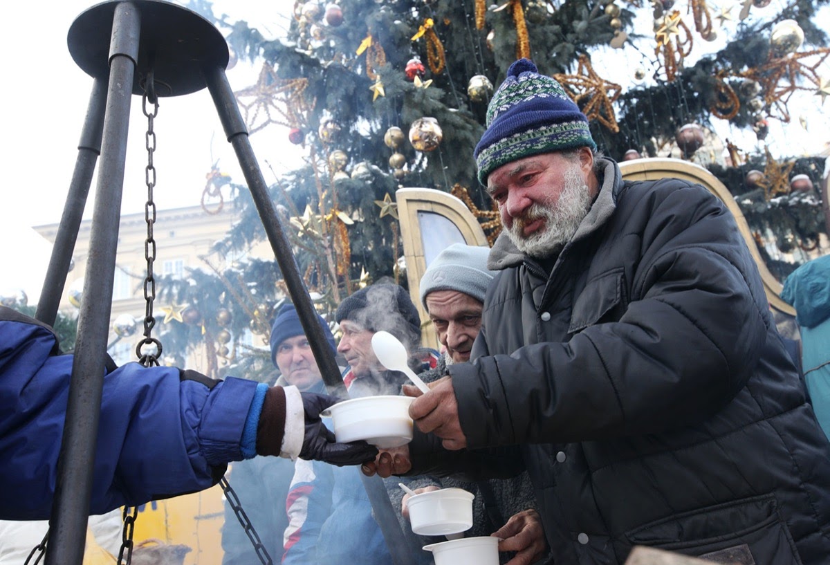 KRAKOW, POLAND - DECEMBER 19, 2010; Christmas Eve for poor and homeless on the Central Market in Cracow. Every year the group Kosciuszko prepares the greatest eve in the open air in Poland.