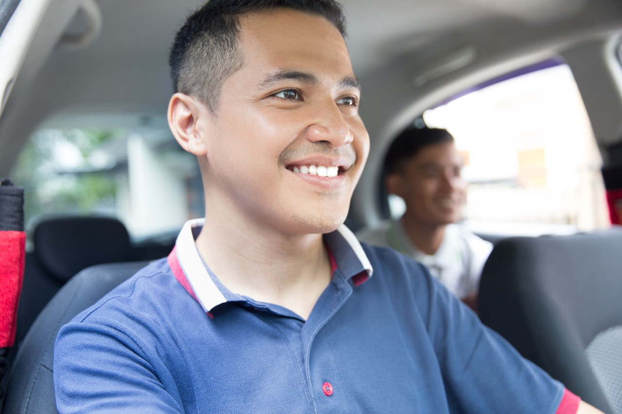 smiling driver; uk uber drivers ruling concept