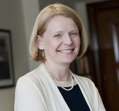 Lauren McFerran smiles at camera; Biden appoints Labor Secretary Marty Walsh and Lauren McFerran concept