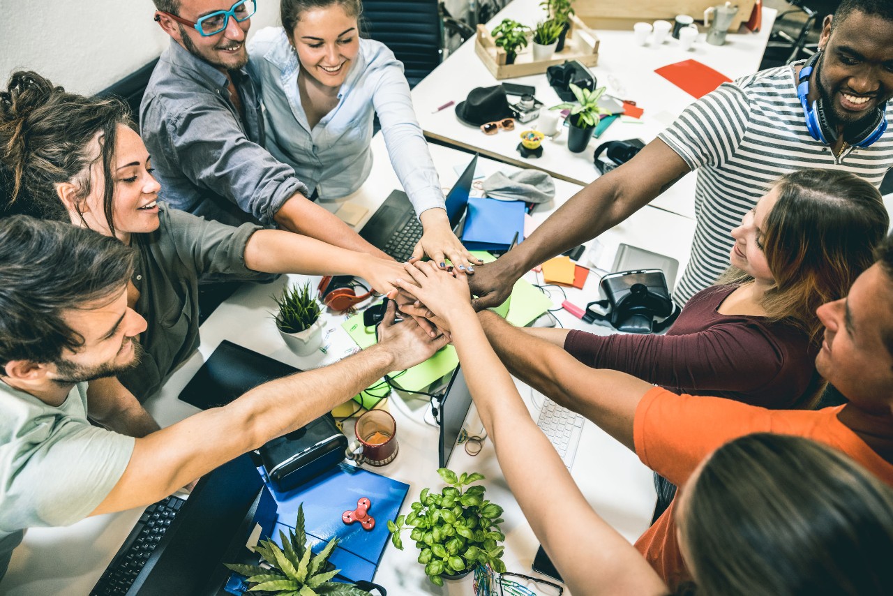 young white collar workers do teambuilding in a conference room; big tech unions concept